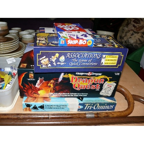 209 - A STACK OF GAMES TO INCLUDE DUNGEONS AND DRAGONS AND A TUB OF VARIOUS DARTS