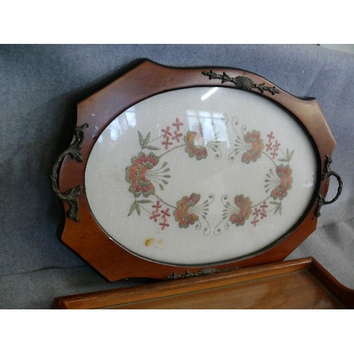 215 - A LOVELY OAK AND GLASS TOPPED SERVING TRAY PLUS A EMBROIDERED SERVING TRAY