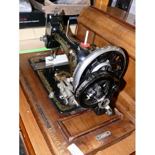 254 - A FRISTER ROSSMAN COFFIN TOPPED VINTAGE HAND CRANKED SEWING MACHINE