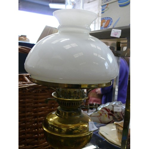 269 - A VINTAGE BRASS OIL LAMP WITH GLASS FUNNEL AND SHADE