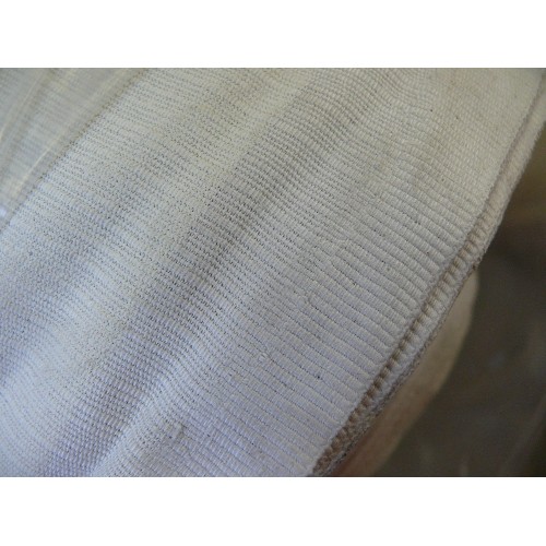 297 - A ROLL OF IVORY CANVAS FABRIC