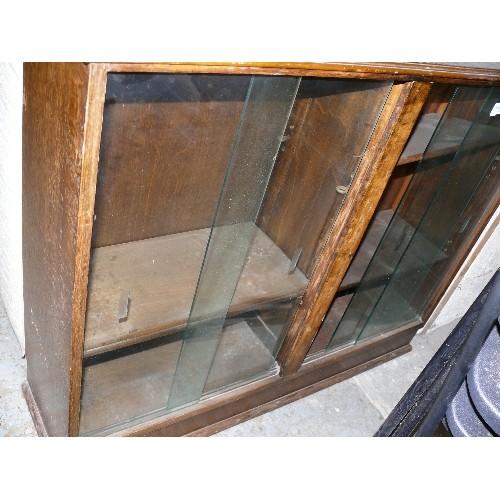 471 - VINTAGE OAK LOW BOOKCASE WITH SLIDING GLASS DOORS