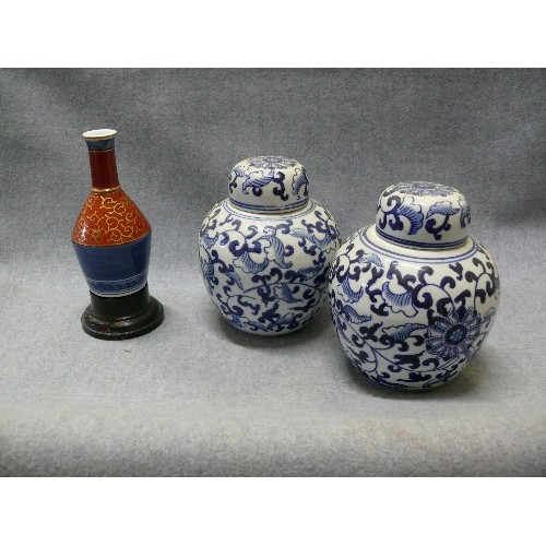 80 - A PAIR OF ORIENTAL GINGER JARS PLUS A SMALL DECORATIVE VASE WITH STAND