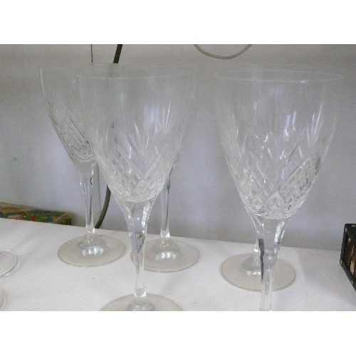 96 - A SET OF 5 CRYSTAL WINE GLASSES AND 4 CRYSTAL CHAMPAGNE FLUTES