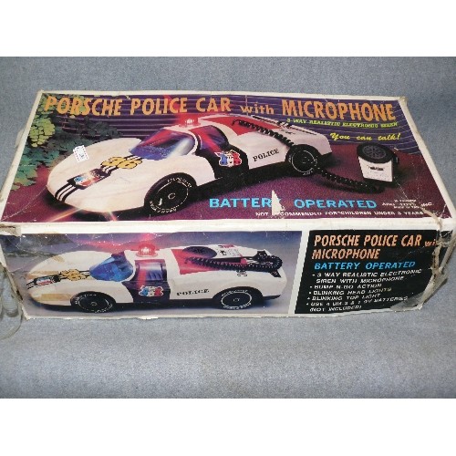 141 - A VINTAGE BATTERY OPERATED PORSCHE POLICE CAR WITH MICROPHONE IN ORIGINAL BOX