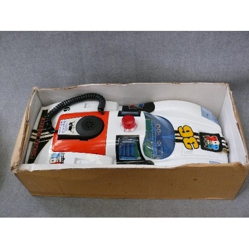 141 - A VINTAGE BATTERY OPERATED PORSCHE POLICE CAR WITH MICROPHONE IN ORIGINAL BOX