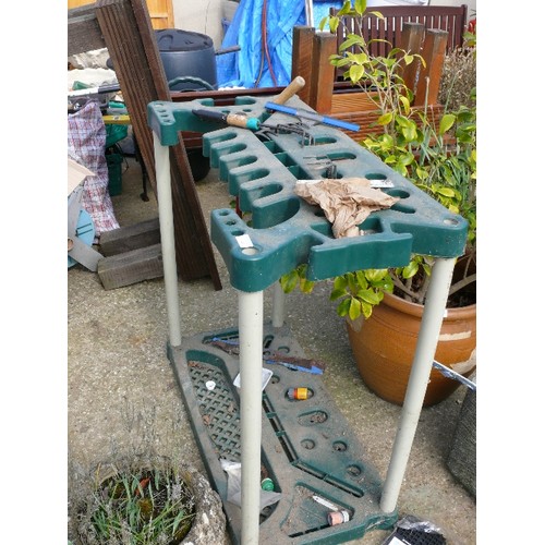 311 - A GARDEN TOOL STAND AND CONTENTS