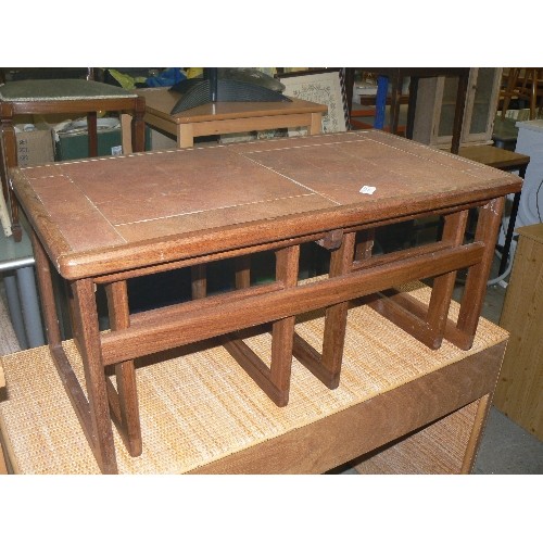 377 - NEST OF THREE TEAK COFFEE TABLES, ONE LONG WITH TWO UNDERNEATH, WITH TILED TOP, BY AMBERCRAFT.