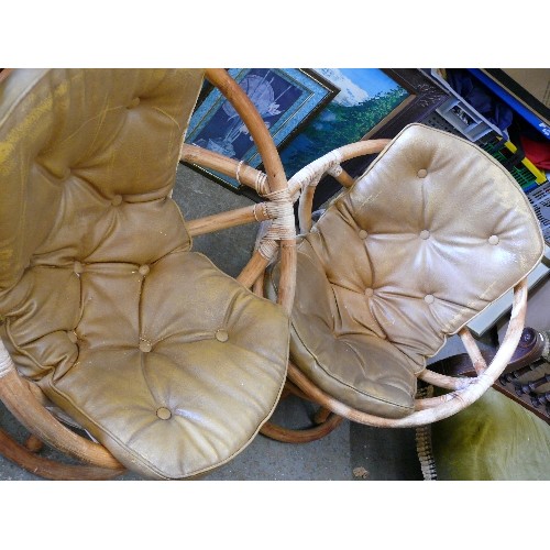 407 - PAIR OF SWIVEL CANE CHAIRS WITH TAN BUTTON LEATHER SEATS