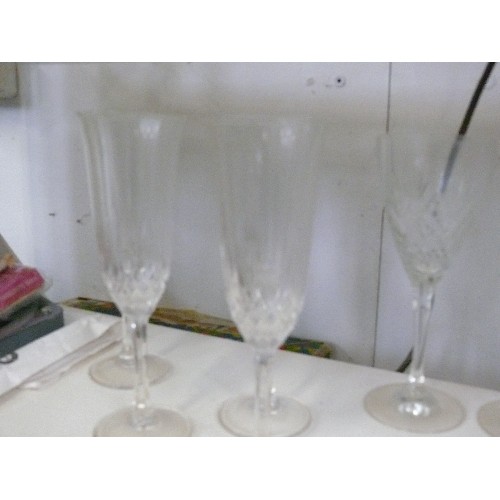 96 - A SET OF 5 CRYSTAL WINE GLASSES AND 4 CRYSTAL CHAMPAGNE FLUTES