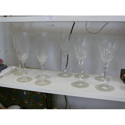 96 - A SET OF 5 CRYSTAL WINE GLASSES AND 4 CRYSTAL CHAMPAGNE FLUTES