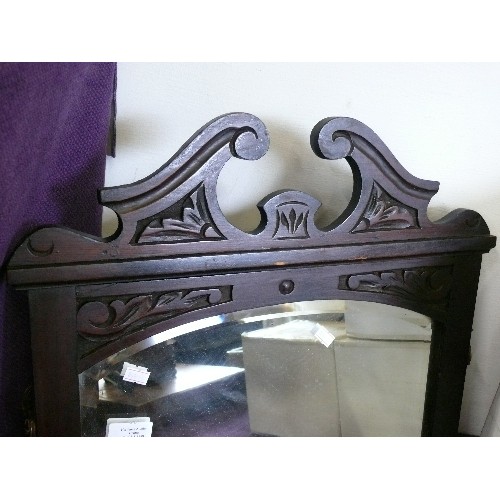 108 - SMALL BEVEL EDGED MIRROR IN CARVED WOODEN FRAME