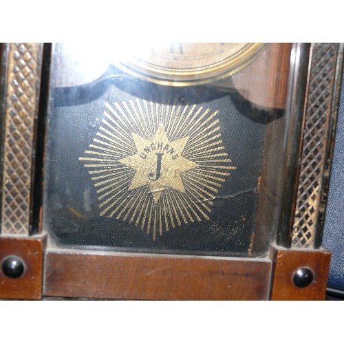 137 - A JUNGHANS WOOD CARVED MANTLE CLOCK