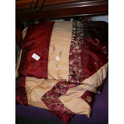 258 - A DECORATIVE EMBROIDERED RED AND GOLD PADDED THROW