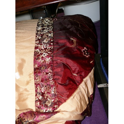 258 - A DECORATIVE EMBROIDERED RED AND GOLD PADDED THROW