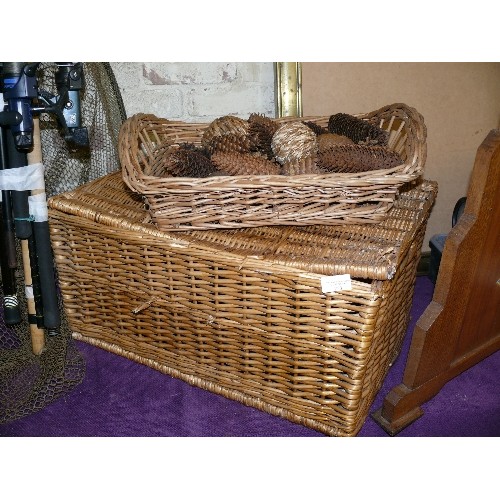 253 - A LARGE WICKER BASKET PLUS A SMALLER ONE WITH CONTENTS OF DECORATIVE PINE CONES