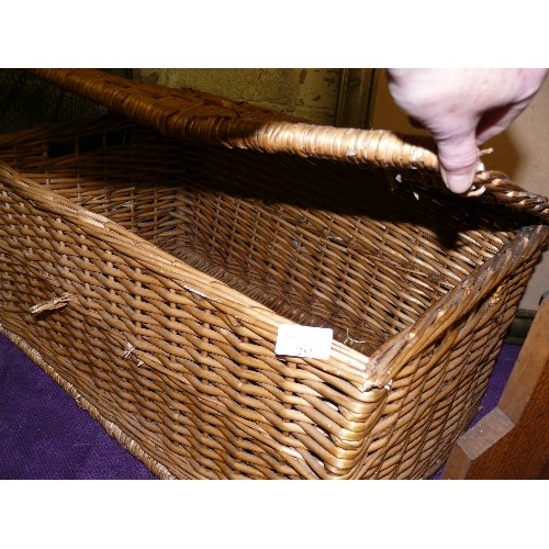 253 - A LARGE WICKER BASKET PLUS A SMALLER ONE WITH CONTENTS OF DECORATIVE PINE CONES