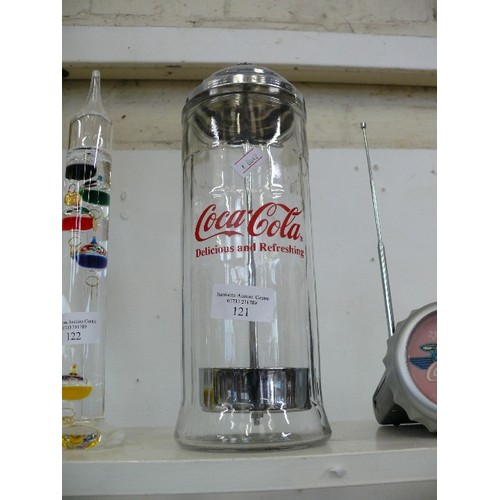 121 - A GLASS COCA COLA STRAW HOLDER PLUS A VINTAGE COCA COLA RADIO AND A COCA COLA GLASS