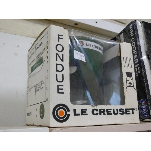 120 - A BOXED GREEN CAST IRON LE CREUSET FONDUE SET