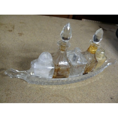 285 - A VINTAGE GLASS BOAT SHAPED CONDIMENT SET