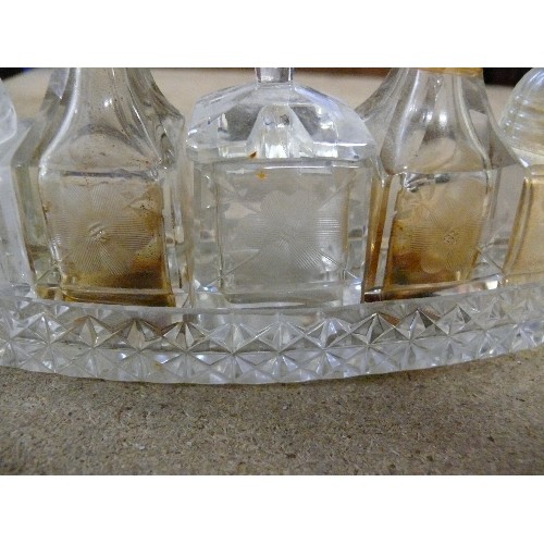 285 - A VINTAGE GLASS BOAT SHAPED CONDIMENT SET