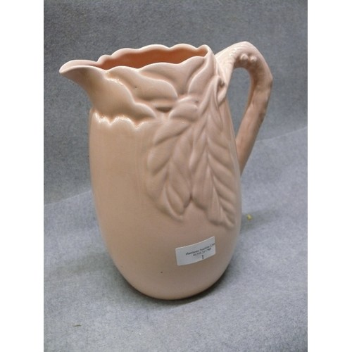 1 - A LARGE CLARICE CLIFF JUG WITH LEAF DESIGN 10 INCHES TALL IN LIGHT APRICOT