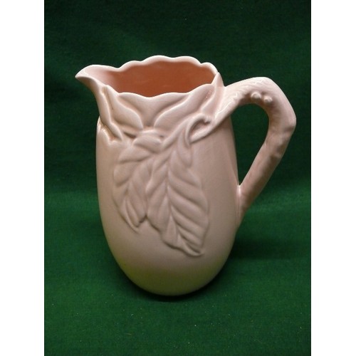 1 - A LARGE CLARICE CLIFF JUG WITH LEAF DESIGN 10 INCHES TALL IN LIGHT APRICOT