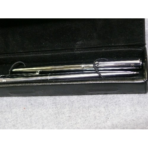 32 - TWO PENS IN A LEATHER CASE