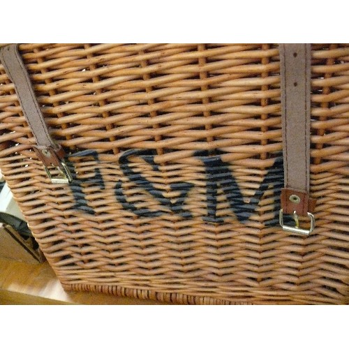 334 - F & M LARGE WICKER BASKET WITH HANDLES AND LEATHER FASTENING STRAPS PLUS ANOTHER SMALL WICKER BASKET