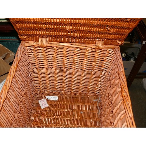 334 - F & M LARGE WICKER BASKET WITH HANDLES AND LEATHER FASTENING STRAPS PLUS ANOTHER SMALL WICKER BASKET