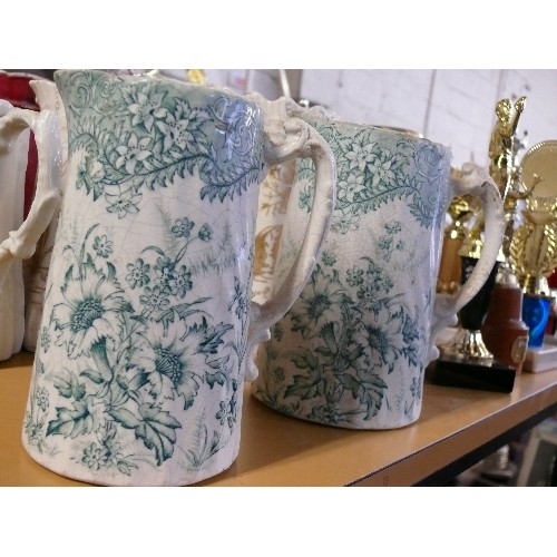 293A - 2 PITCHER JUGS IN WHITE WITH GREEN DAISIES