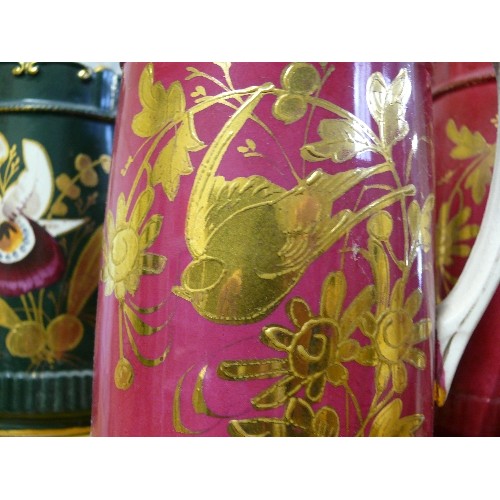 293B - 2 PITCHER JUGS IN CERISE WITH GILT BIRDS