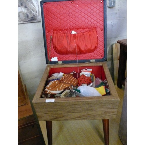 387 - RETRO WORKBOX/STOOL ON SPAYED  LEGS,  BLACK VINYL SEAT, LINED IN RED  WITH  SEWING CONTENTS