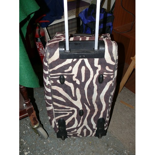 174 - A LARGE WHEELED ZEBRA STRIPED HOLDALL BY 'DOMO'