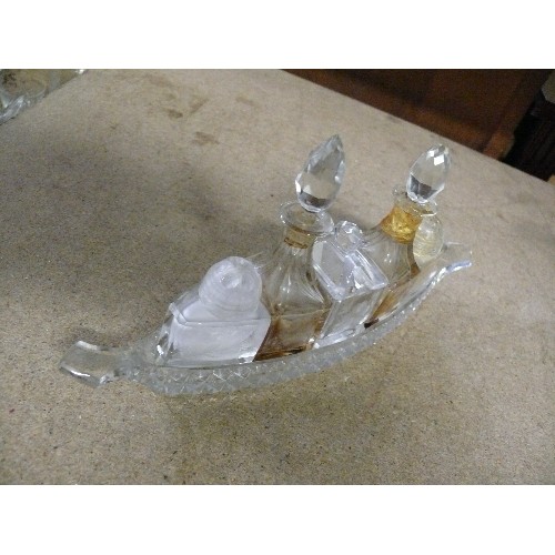 285 - A VINTAGE GLASS BOAT SHAPED CONDIMENT SET