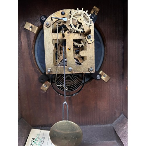 350 - A late 19th Century Mantel Clock in a walnut case. The movement by Badische Uhrenfabrick Germany. En... 