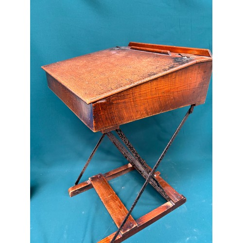 463 - A circa 1920's child's folding desk, with good original patina to the wood. Brass inkwell cap