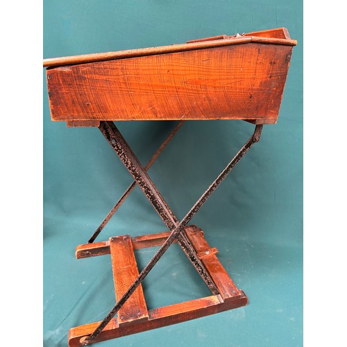 463 - A circa 1920's child's folding desk, with good original patina to the wood. Brass inkwell cap