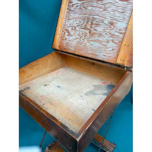 463 - A circa 1920's child's folding desk, with good original patina to the wood. Brass inkwell cap