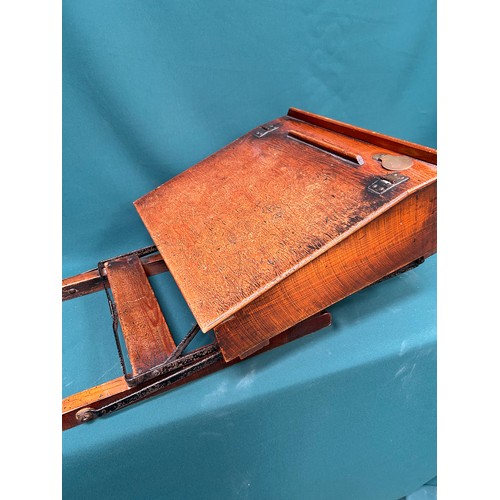 463 - A circa 1920's child's folding desk, with good original patina to the wood. Brass inkwell cap