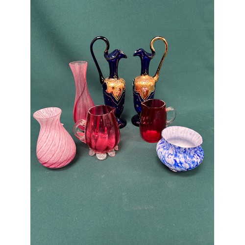 203 - A pair of Victorian cobalt blue glass ewer shaped vases overlaid with gilt decoration, a pink Caithn... 