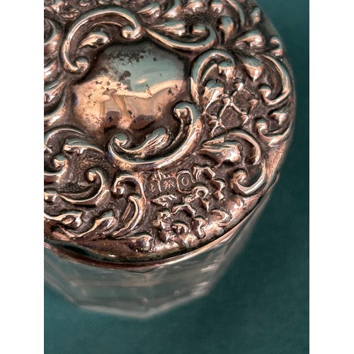 20 - A silver topped dressing table jar. Unusual Art Deco chevron design to the cut glass jar.  Birmingha... 