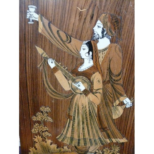 114 - A DECORATIVE WOODEN PLAQUE INLAID WITH MOTHER OF PEARL