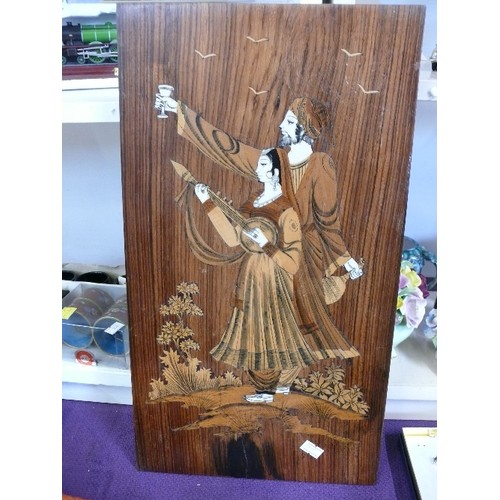 114 - A DECORATIVE WOODEN PLAQUE INLAID WITH MOTHER OF PEARL