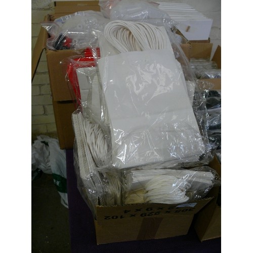 187 - A LARGE BOX OF BRAND NEW PAPER GIFT BAGS IN WHITE AND RED