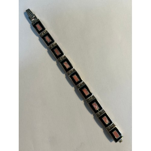 30 - An Art Deco style silver bracelet, the square links set with pink shell in a black enamel frame and ... 