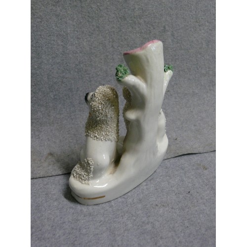 95A - A STAFFORDSHIRE DOG POSY VASE/PEN HOLDER