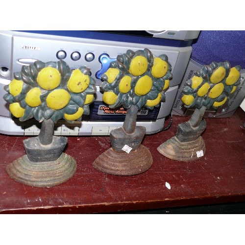 295 - 3 FRUIT TREE CAST IRON DOORSTOPS