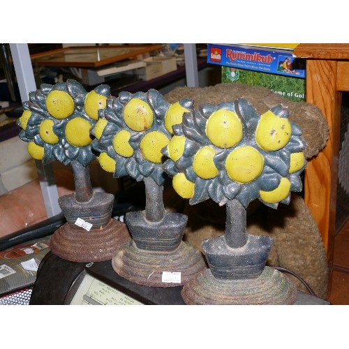 295 - 3 FRUIT TREE CAST IRON DOORSTOPS