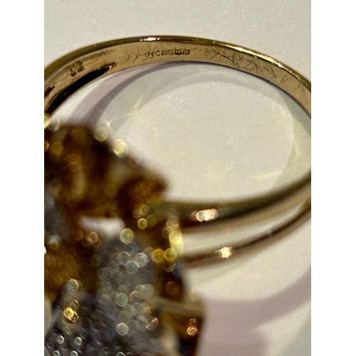 84 - A stunning 9ct gold flower ring, the petals set with diamonds. Size S/T, 5.9 grams